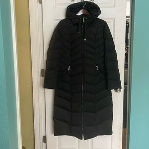 Long, black Women’s Tahari winter coat. Like new condition. Barely worn. Size L.